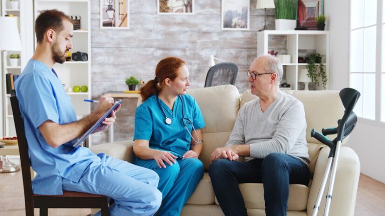 team-male-female-nurses-talking-with-old-retired-man-bright-cozy-nursing-home_482257-20741